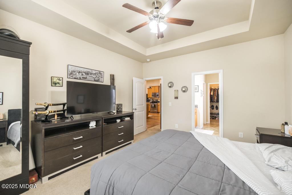 135 Abelia Lane Byron, GA 31008 - Photo 17 of 32 a bedroom with a bed and a flat screen tv