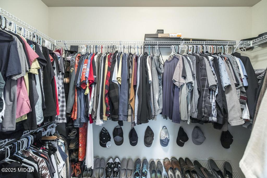135 Abelia Lane Byron, GA 31008 - Photo 20 of 32 a view of walk in closet with clothes and shoes