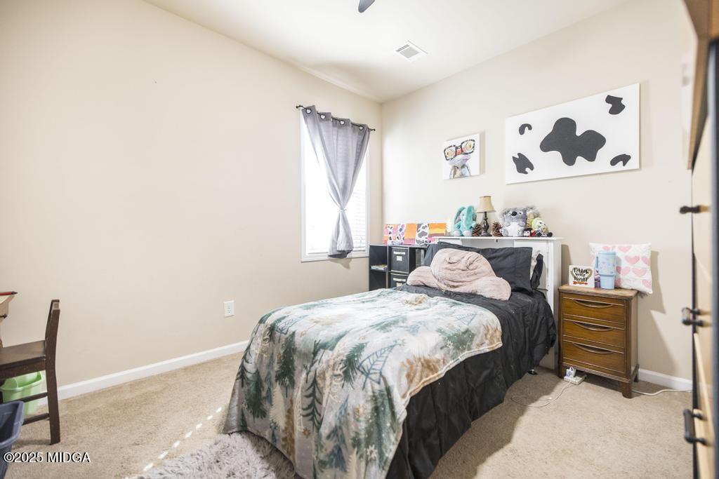 135 Abelia Lane Byron, GA 31008 - Photo 22 of 32 a bedroom with a bed and a cabinets