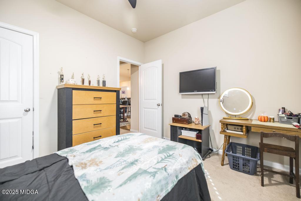 135 Abelia Lane Byron, GA 31008 - Photo 23 of 32 a bedroom with a bed and a television