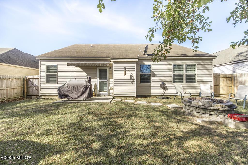 135 Abelia Lane Byron, GA 31008 - Photo 28 of 32 a view of a house with backyard and sitting area