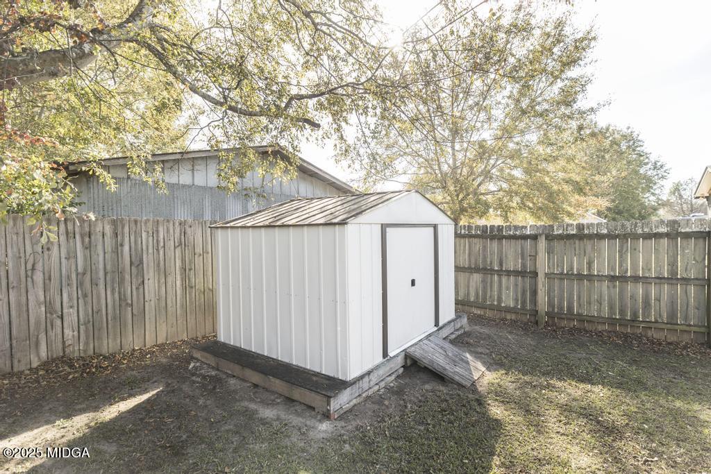 135 Abelia Lane Byron, GA 31008 - Photo 31 of 32 a view of backyard and trees