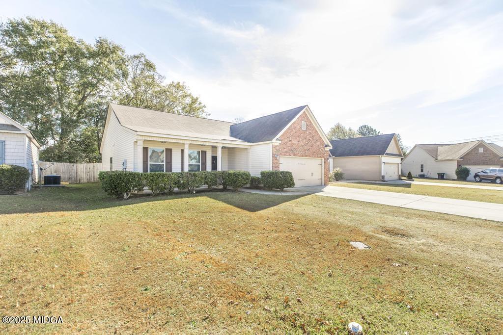 135 Abelia Lane Byron, GA 31008 - Photo 4 of 32 a view of house with yard and ocean view