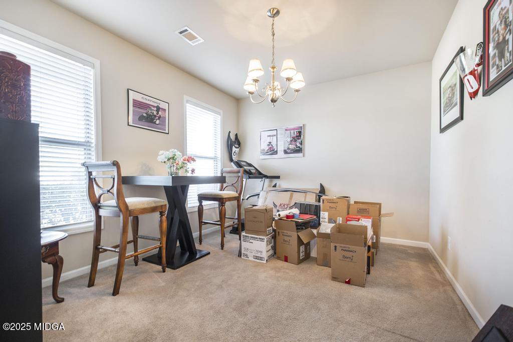 135 Abelia Lane Byron, GA 31008 - Photo 8 of 32 a view of a dining room with furniture