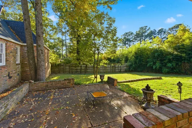 a view of backyard with swimming pool