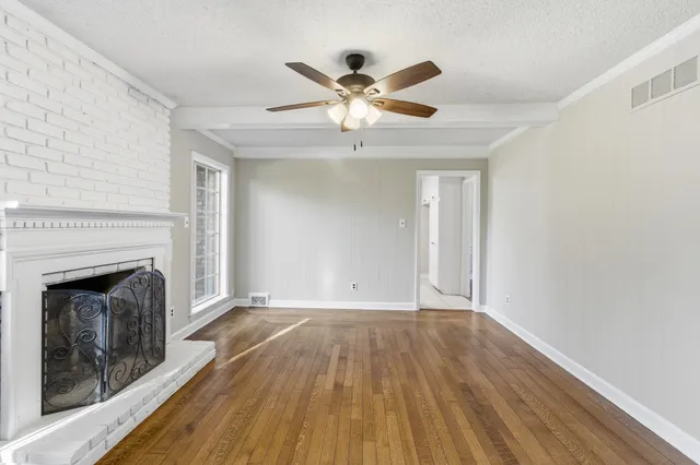 a kitchen with white cabinets a sink and white appliances
