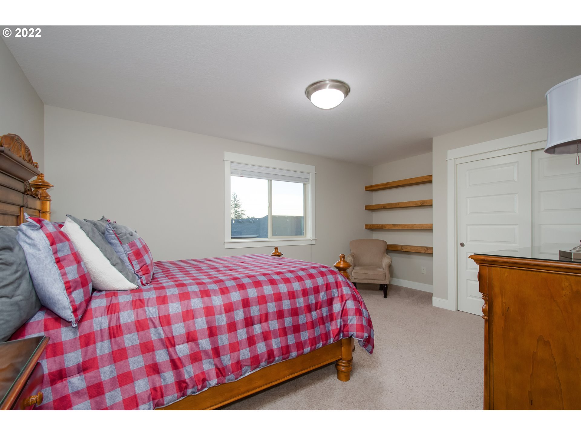 2507 Northeast 176th Street Ridgefield, WA 98642 - Photo 23 of 32 a bedroom with a bed and window