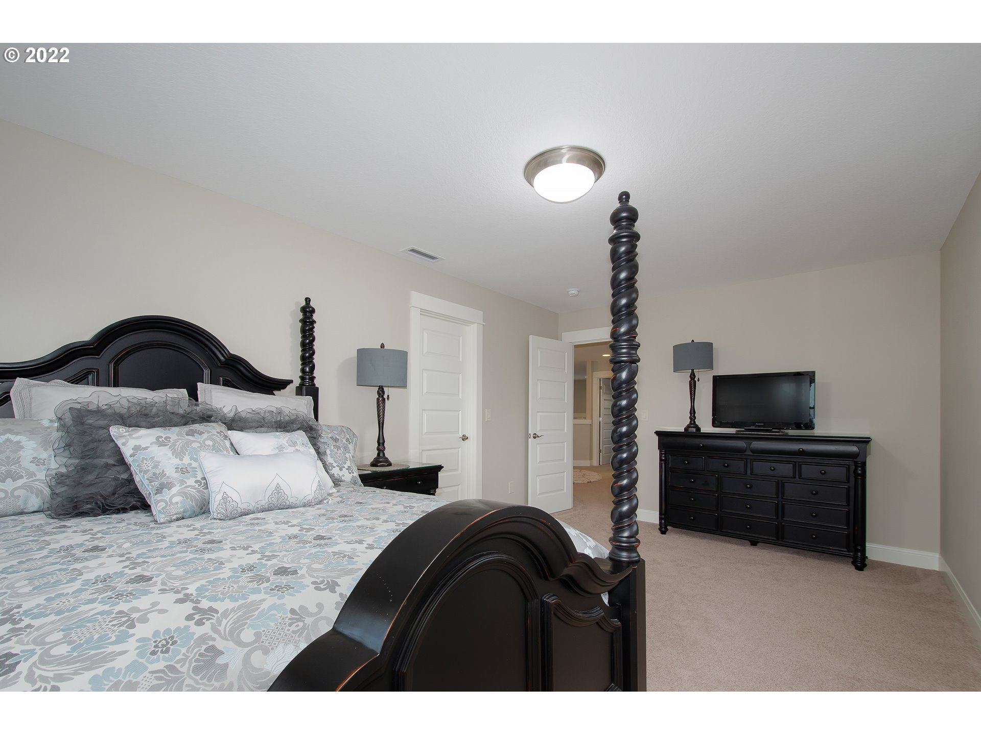 2507 Northeast 176th Street Ridgefield, WA 98642 - Photo 24 of 32 a bedroom with a bed and a television