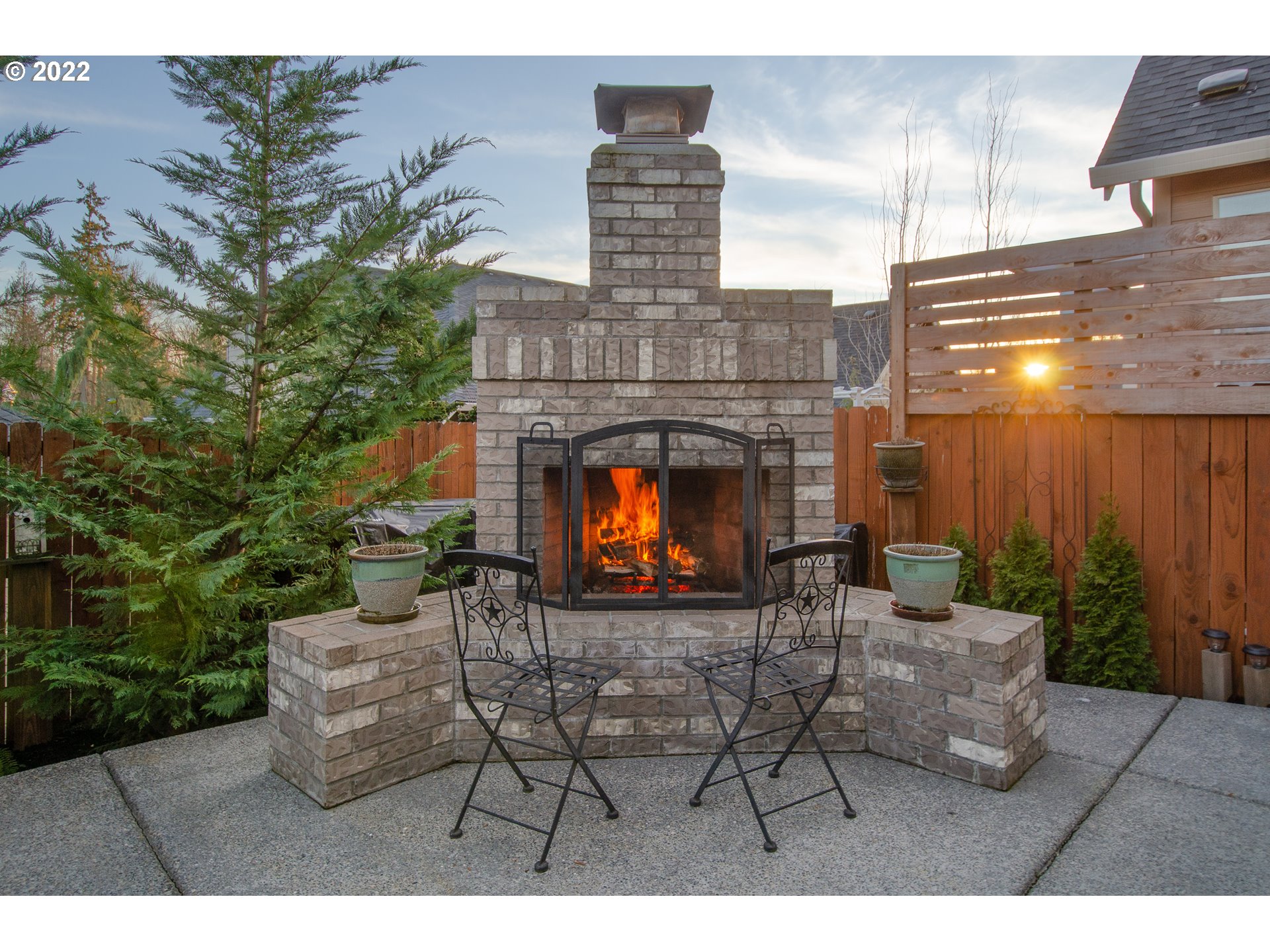 2507 Northeast 176th Street Ridgefield, WA 98642 - Photo 31 of 32 a view of a patio with a table and chairs and potted plants