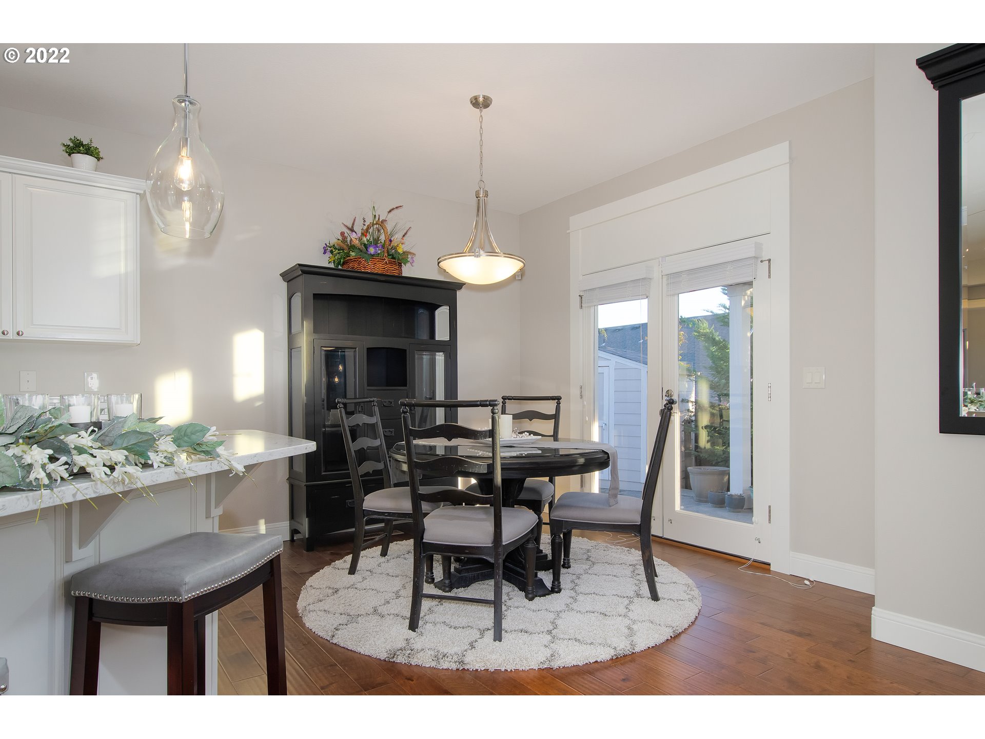 2507 Northeast 176th Street Ridgefield, WA 98642 - Photo 9 of 32 a dining room with furniture a chandelier and wooden floor