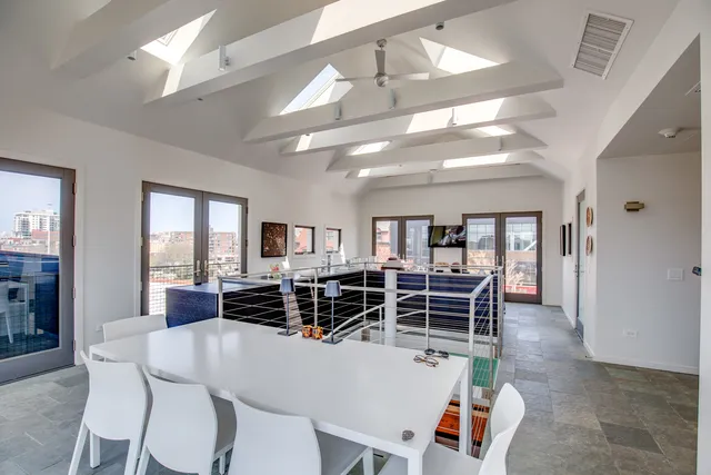 a view of a dining room with furniture window and outside view