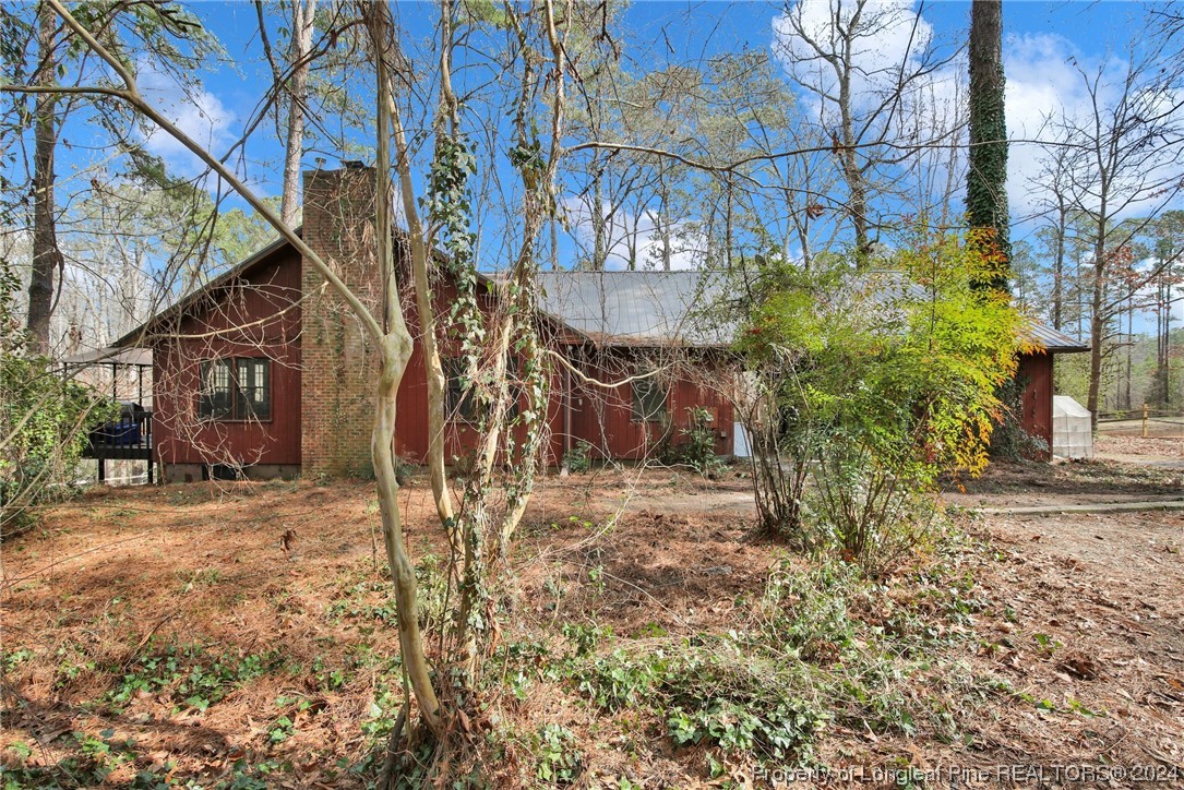 417 Farm Life School Road Carthage, NC 28327 - Photo 2 of 33 a view of a yard with some trees