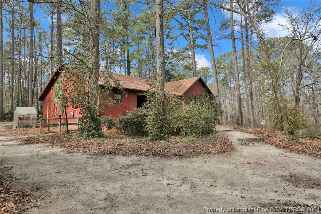417 Farm Life School Road Carthage, NC 28327 - Photo 29 of 33 a view of house and covered with trees