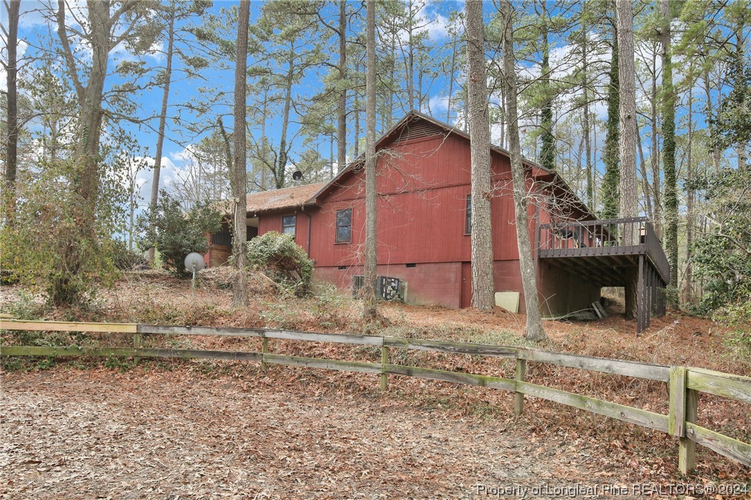 417 Farm Life School Road Carthage, NC 28327 - Photo 32 of 33 a house that has a tree in front of it