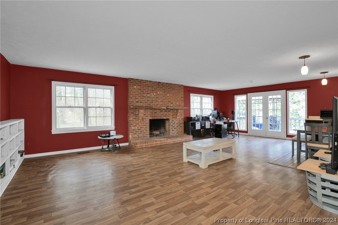 417 Farm Life School Road Carthage, NC 28327 - Photo 5 of 33 a living room with furniture large window and fireplace