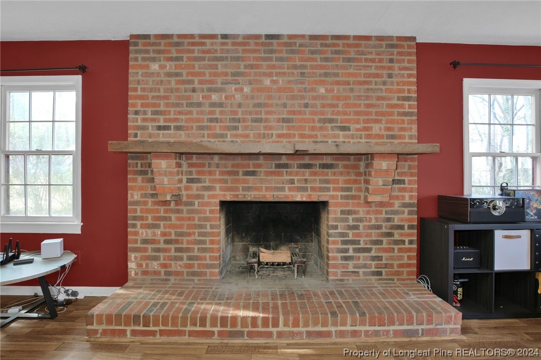 417 Farm Life School Road Carthage, NC 28327 - Photo 8 of 33 a living room with furniture a fireplace and a table