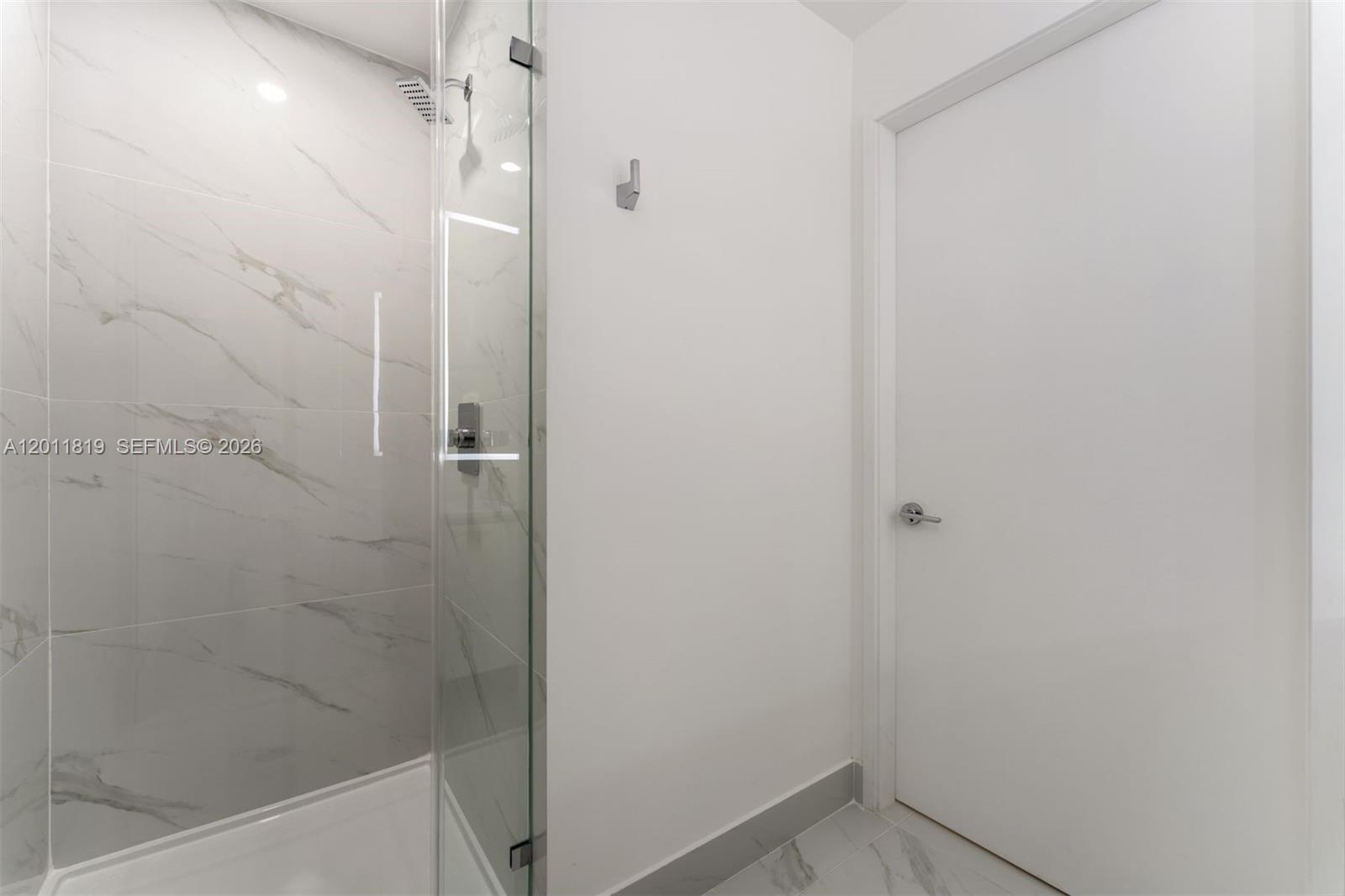 700 Northeast 24th Street, Unit 2504 Miami, FL 33137 - Photo 29 of 52 Elegant secondary bathroom with high-end European fixtures, modern vanity, and curated finishes consistent with Aria Reserve’s luxury design standards.
