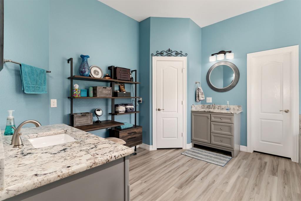 10832 Ridge Country Road Haslet, TX 76052 - Photo 15 of 30 Granite-topped vanities with great storage & rectangular sinks, round mirrors & decorative lighting.