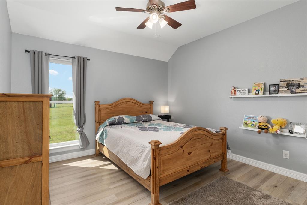 10832 Ridge Country Road Haslet, TX 76052 - Photo 19 of 30 Secondary bedroom with nice view of the side yard.