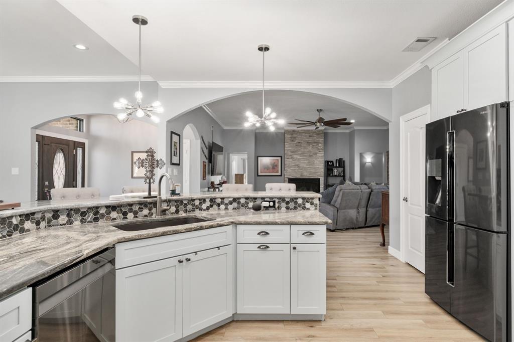 10832 Ridge Country Road Haslet, TX 76052 - Photo 9 of 30 Visit with your guests while finalizing the dinner details in the kitchen!