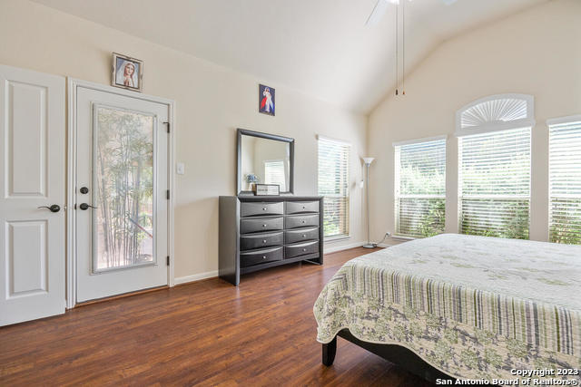 9634 Jason Bend Helotes, TX 78023 - Photo 17 of 43 a bedroom with a bed and a large window