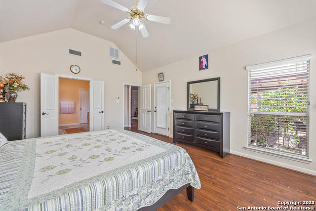 9634 Jason Bend Helotes, TX 78023 - Photo 18 of 43 a bedroom with a bed and wooden floor