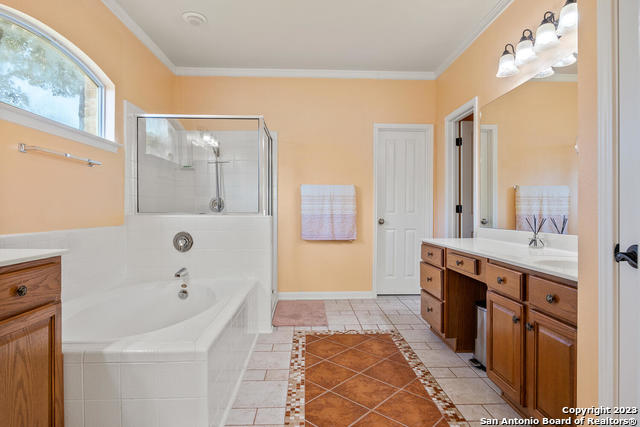 9634 Jason Bend Helotes, TX 78023 - Photo 19 of 43 a bathroom with a tub sink and mirror