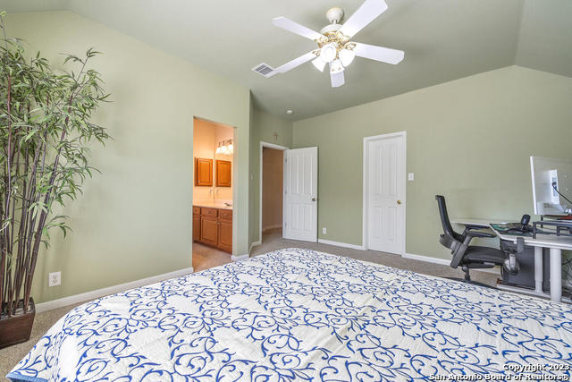 9634 Jason Bend Helotes, TX 78023 - Photo 30 of 43 a bedroom with a bed and a chair