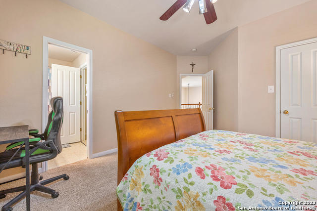 9634 Jason Bend Helotes, TX 78023 - Photo 35 of 43 a bedroom with a bed potted plant with the dresser