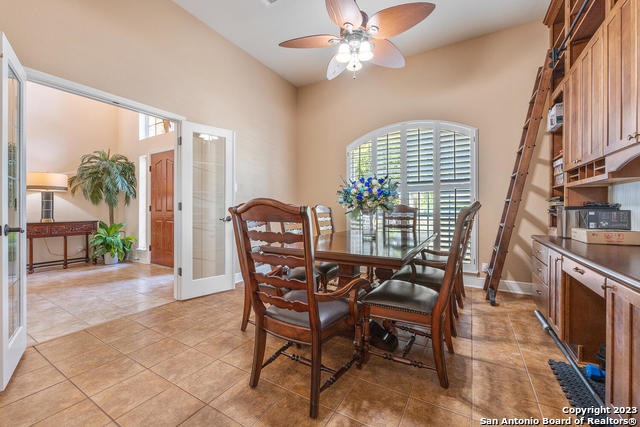 9634 Jason Bend Helotes, TX 78023 - Photo 4 of 43 a view of a dining room with furniture window and wooden floor
