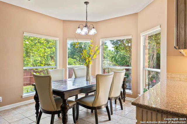 9634 Jason Bend Helotes, TX 78023 - Photo 10 of 43 a view of a dining room with furniture window and outside view