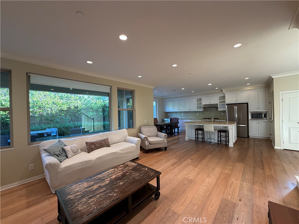 45 Diamond Irvine, CA 92620 - Photo 4 of 12 a living room with furniture and a wooden floor