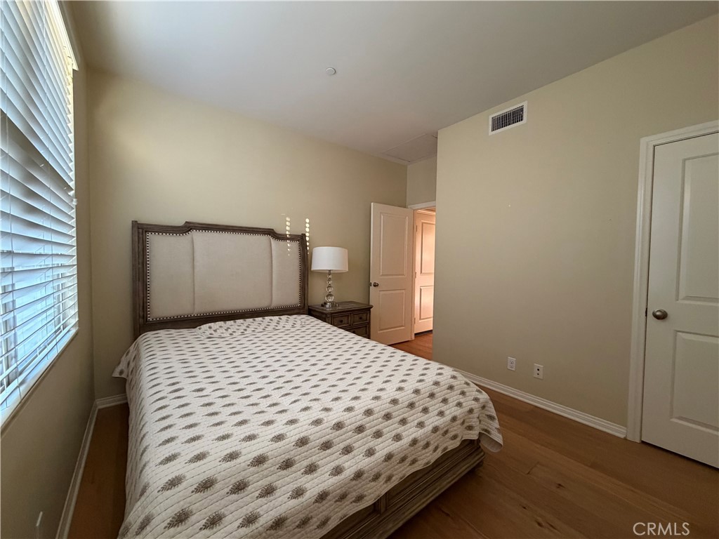 45 Diamond Irvine, CA 92620 - Photo 7 of 12 a bedroom with a bed and wooden floor
