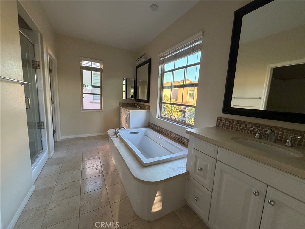 45 Diamond Irvine, CA 92620 - Photo 9 of 12 a bathroom with a sink and a mirror
