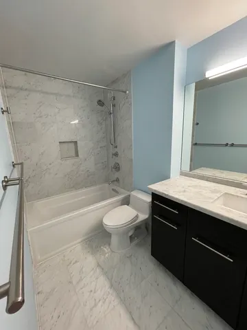 a bathroom with a sink a toilet and a bathtub