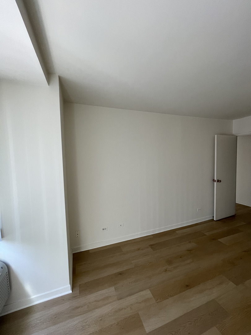 211 East Ohio Street, Unit 1013 Chicago, IL 60611 - Photo 6 of 12 a view of an empty room