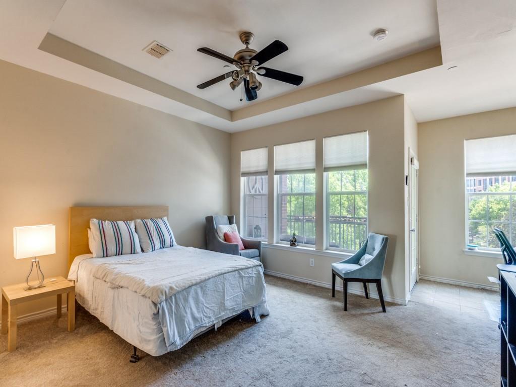 15711 Spectrum Drive, Unit 80 Addison, TX 75001 - Photo 17 of 26 a spacious bedroom with a bed and a large window