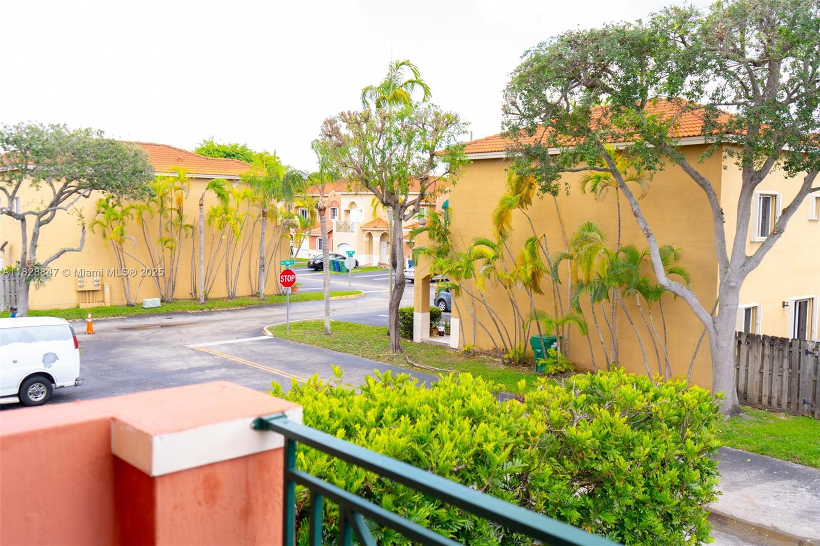 13402 Southwest 153rd Street, Unit 1904 Miami, FL 33177 - Photo 11 of 26 a view of a backyard with plants and large trees