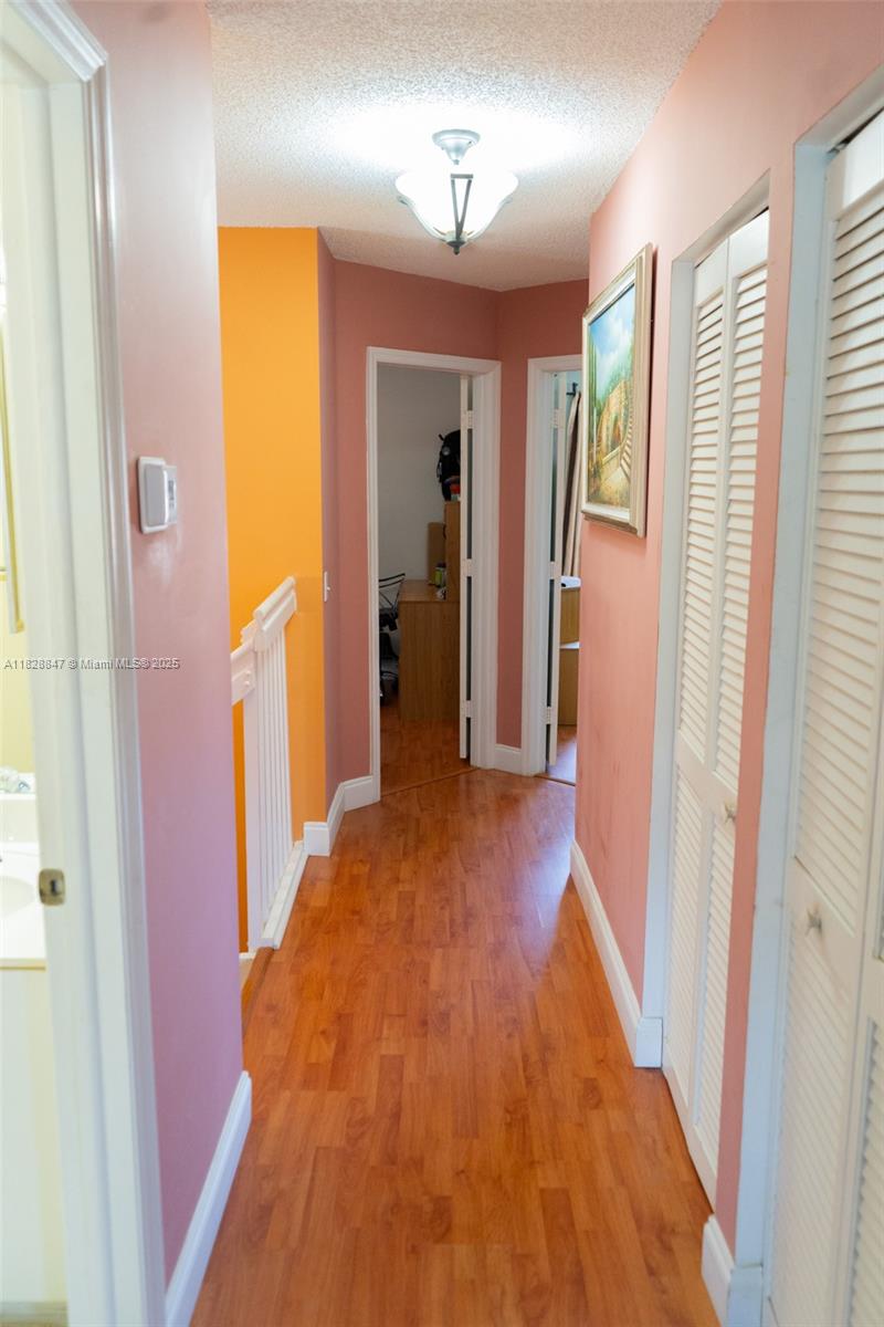 13402 Southwest 153rd Street, Unit 1904 Miami, FL 33177 - Photo 14 of 26 a view of hallway with furniture and a window