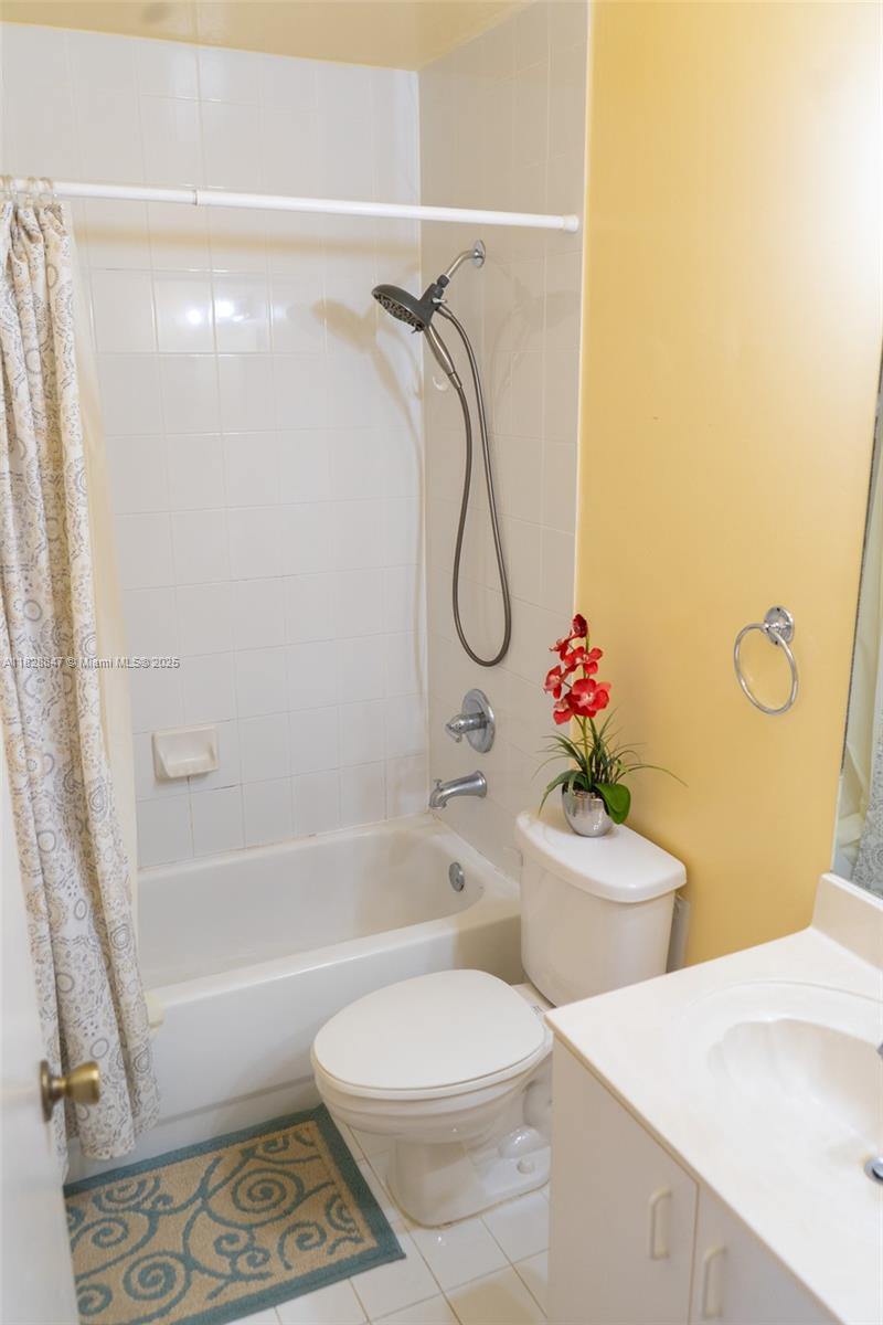13402 Southwest 153rd Street, Unit 1904 Miami, FL 33177 - Photo 16 of 26 a bathroom with a shower a toilet and a shower