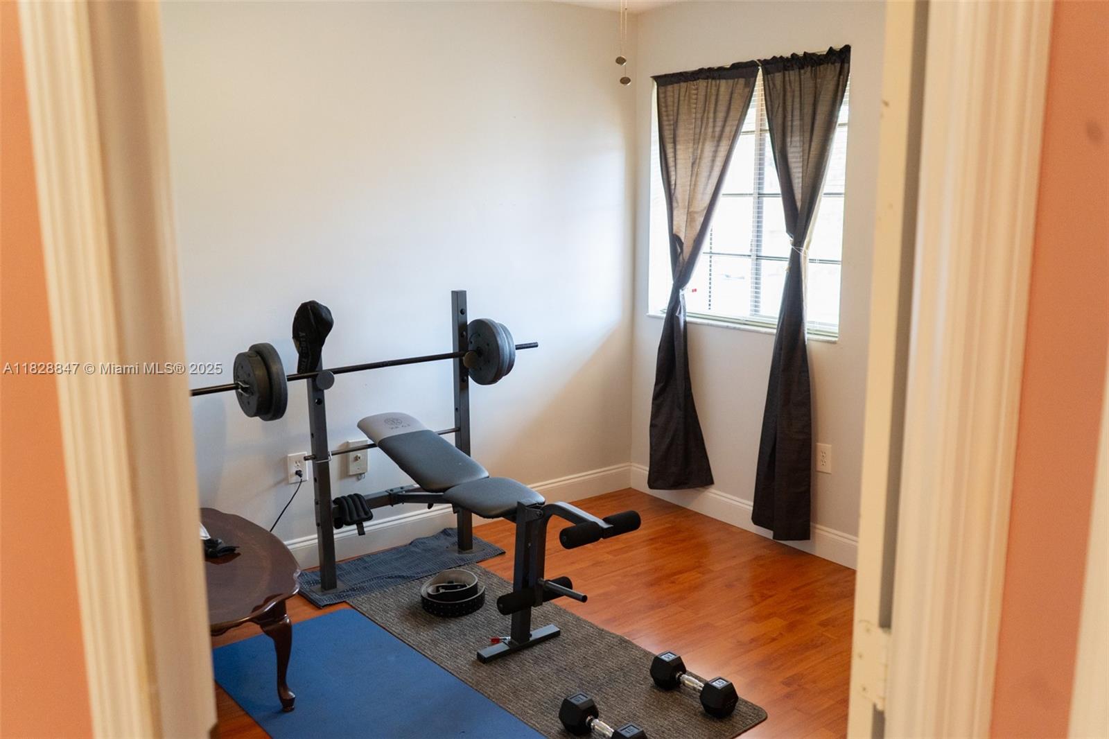 13402 Southwest 153rd Street, Unit 1904 Miami, FL 33177 - Photo 18 of 26 a room with gym equipment and windows