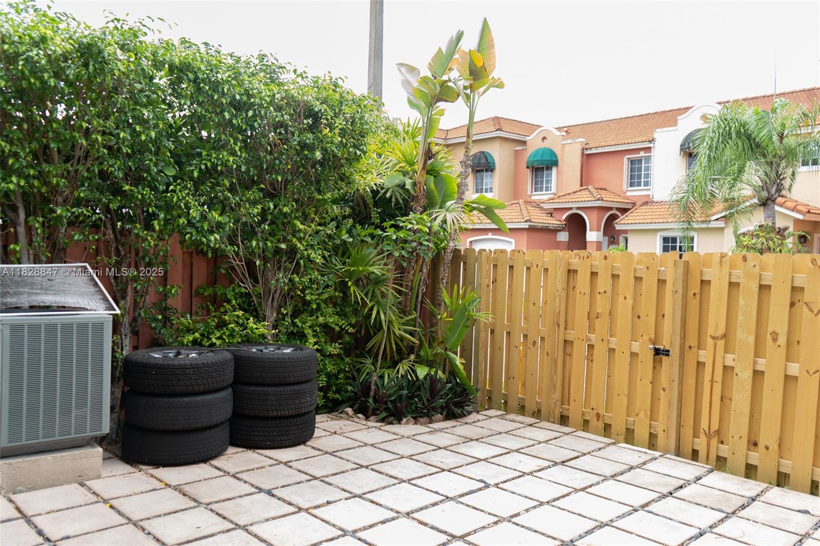 13402 Southwest 153rd Street, Unit 1904 Miami, FL 33177 - Photo 20 of 26 a front view of a house with a garden