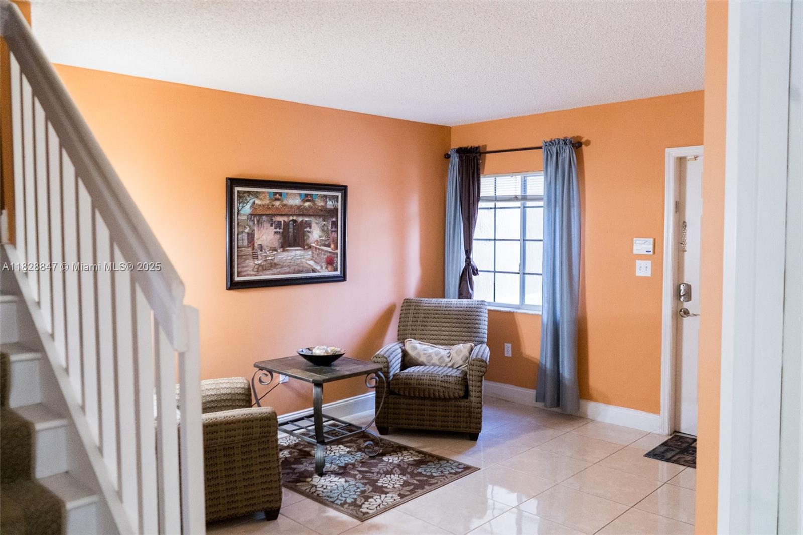 13402 Southwest 153rd Street, Unit 1904 Miami, FL 33177 - Photo 2 of 26 a living room with furniture a rug and a window