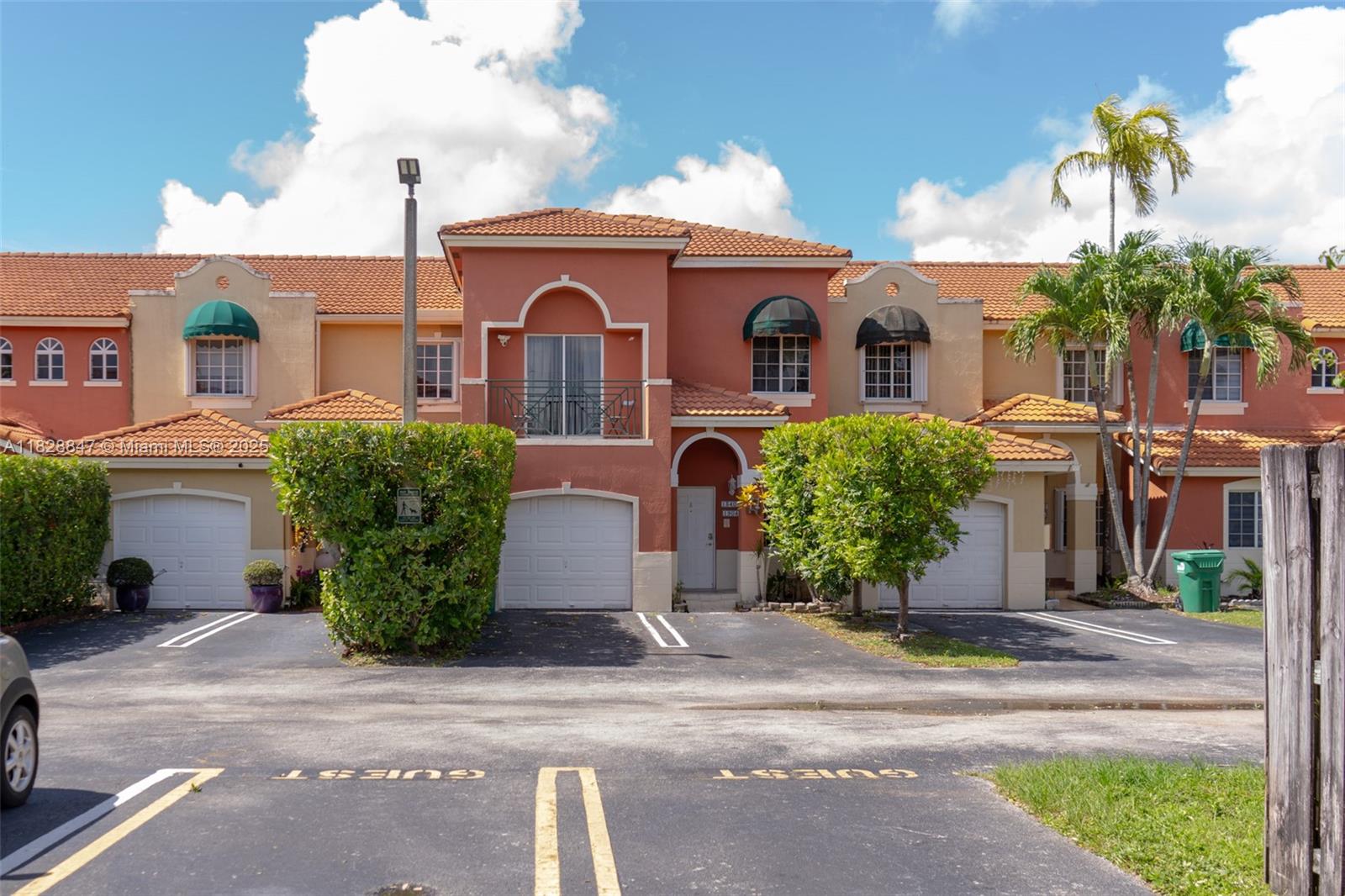13402 Southwest 153rd Street, Unit 1904 Miami, FL 33177 - Photo 26 of 26 a front view of a house with garden