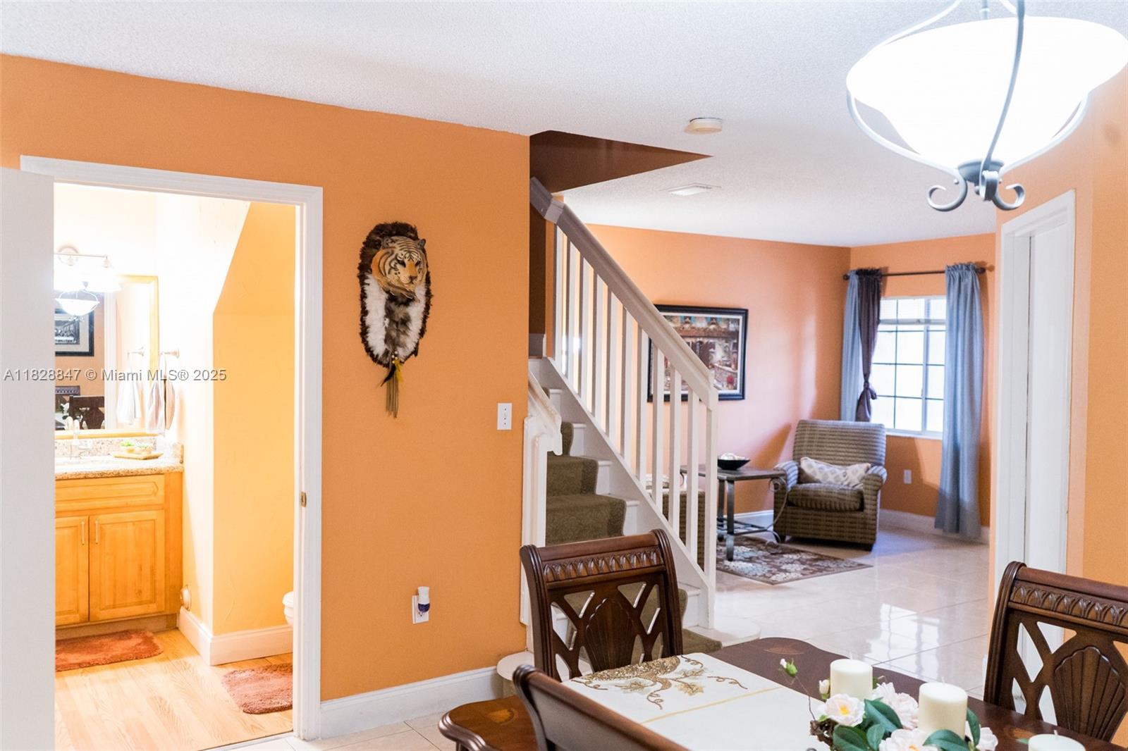 13402 Southwest 153rd Street, Unit 1904 Miami, FL 33177 - Photo 3 of 26 a living room with furniture a fireplace and a large window