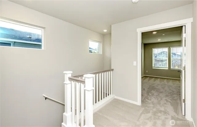 a view of a hallway with windows
