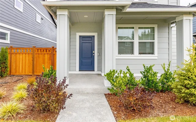 a view of a house with potted plants