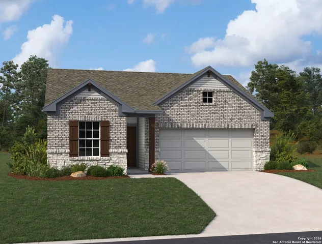 a front view of a house with a garden and plants
