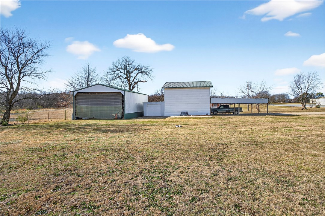 17374 Heavy Chevy Road Siloam Springs, AR 72761 - Photo 21 of 40 View of yard with an outdoor structure