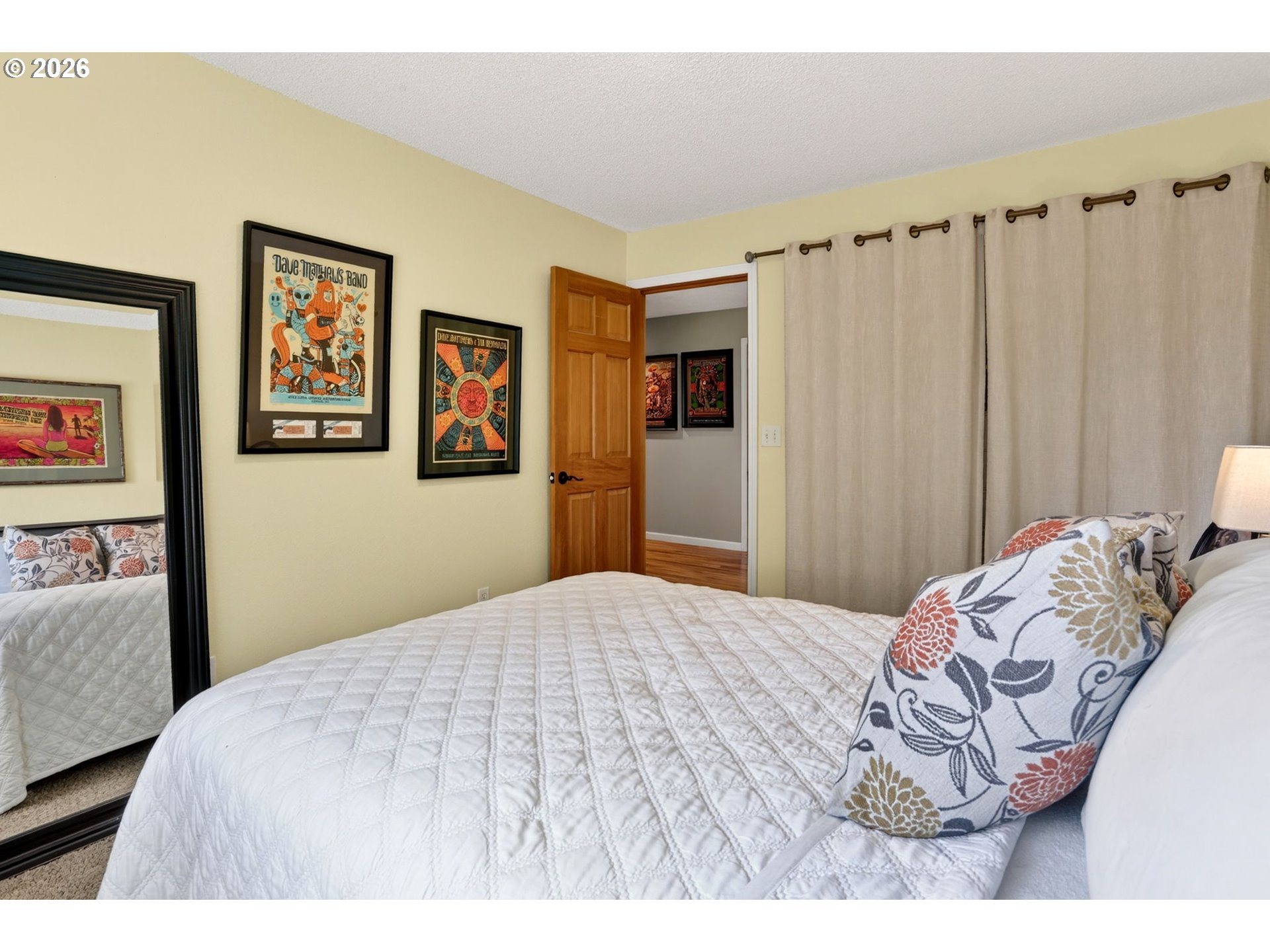 1776 Southeast 114th Place Portland, OR 97216 - Photo 37 of 47 a bedroom with a bed and a painting on the wall